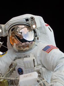 Preview wallpaper astronaut, spacesuit, helmet, mirror, reflection, space