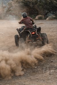 Preview wallpaper atv, man, helmet, dust, dirt