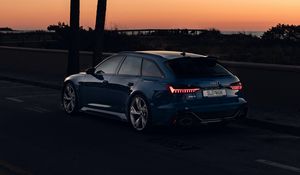 Preview wallpaper audi, car, blue, road, dusk, palm trees