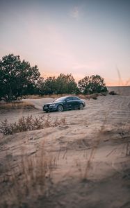 Preview wallpaper audi, car, sand, trees
