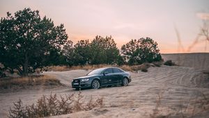 Preview wallpaper audi, car, sand, trees