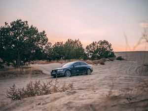 Preview wallpaper audi, car, sand, trees
