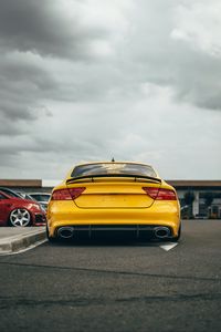 Preview wallpaper audi, car, yellow, back view, road