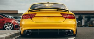 Preview wallpaper audi, car, yellow, back view, road