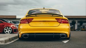 Preview wallpaper audi, car, yellow, back view, road