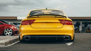 Preview wallpaper audi, car, yellow, back view, road