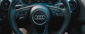 Preview wallpaper audi, interior, steering wheel, speedometer, legs