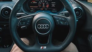 Preview wallpaper audi, interior, steering wheel, speedometer, legs