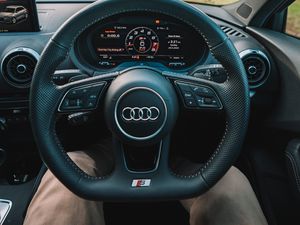 Preview wallpaper audi, interior, steering wheel, speedometer, legs