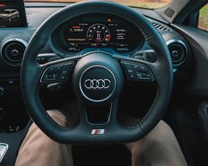 Preview wallpaper audi, interior, steering wheel, speedometer, legs