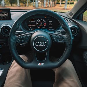 Preview wallpaper audi, interior, steering wheel, speedometer, legs