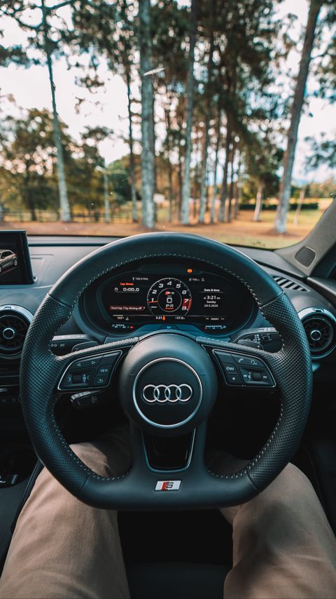 480x854 Wallpaper audi, interior, steering wheel, speedometer, legs