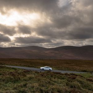 Preview wallpaper auto, road, traffic, mountains, clouds