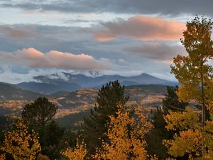 Preview wallpaper autumn, mountains, sky, clouds, trees, aspens, pines, evening