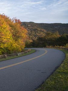 Preview wallpaper autumn, road, rotate, marking