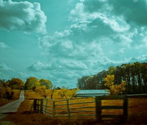 Preview wallpaper autumn, sky, fence, road, paints, colors, cloudy