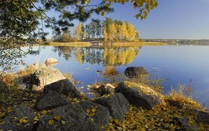 Preview wallpaper autumn, stones, trees, leaves, birches, lake, island, coast