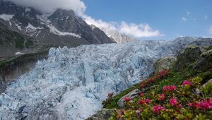 Preview wallpaper avalanche, snow, flowers, mountains, dirty, clouds, sky, blue