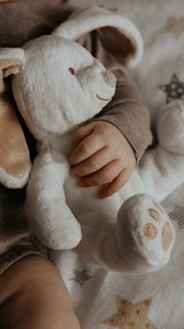 Preview wallpaper baby, hand, toy, rabbit