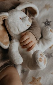 Preview wallpaper baby, hand, toy, rabbit