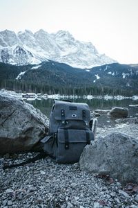 Preview wallpaper backpack, mountain, lake, shore, nature, gray