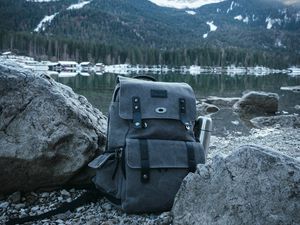 Preview wallpaper backpack, mountain, lake, shore, nature, gray