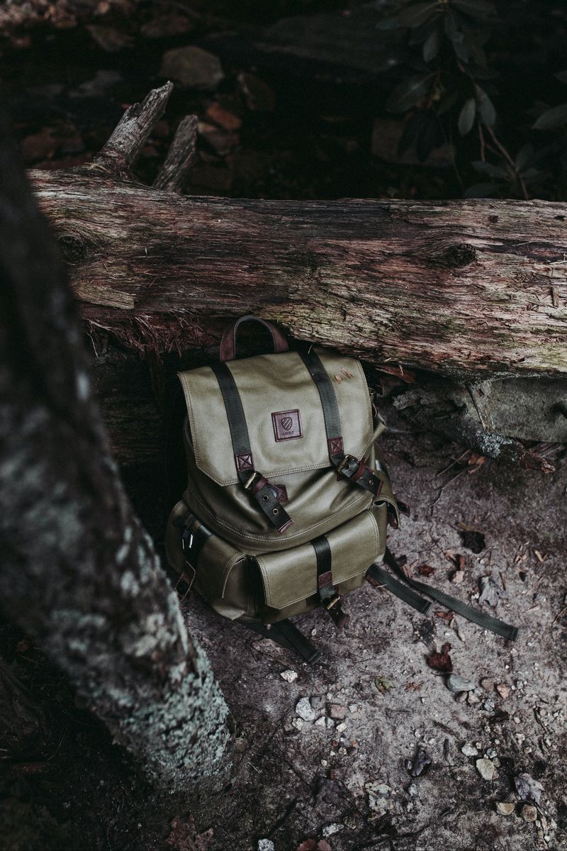 800x1200 Wallpaper backpack, rocks, cave