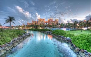 Preview wallpaper bahamas, island, landscape, rocks, grass, tree, water, sky, clouds, buildings, hdr