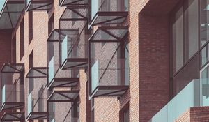 Preview wallpaper balconies, building, facade, bricks, architecture