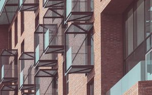 Preview wallpaper balconies, building, facade, bricks, architecture