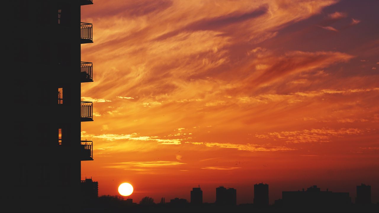 Wallpaper balcony, sunset, sky, skyline, city