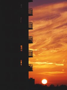 Preview wallpaper balcony, sunset, sky, skyline, city