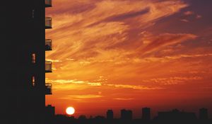 Preview wallpaper balcony, sunset, sky, skyline, city