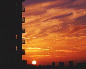 Preview wallpaper balcony, sunset, sky, skyline, city