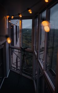 Preview wallpaper balcony, window, telescope, garland, glare