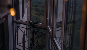 Preview wallpaper balcony, window, telescope, garland, glare