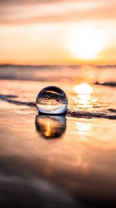 Preview wallpaper ball, coast, sunset, sea, reflection