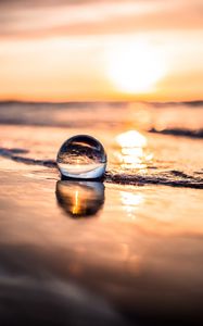 Preview wallpaper ball, coast, sunset, sea, reflection
