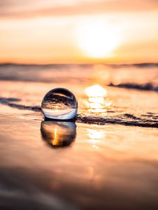 Preview wallpaper ball, coast, sunset, sea, reflection