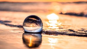 Preview wallpaper ball, coast, sunset, sea, reflection