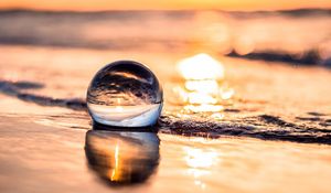 Preview wallpaper ball, coast, sunset, sea, reflection