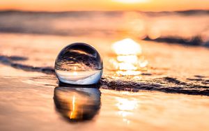 Preview wallpaper ball, coast, sunset, sea, reflection
