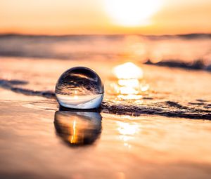 Preview wallpaper ball, coast, sunset, sea, reflection