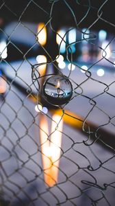 Preview wallpaper ball, glass, fence, mesh, light