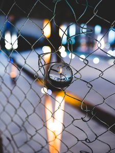 Preview wallpaper ball, glass, fence, mesh, light