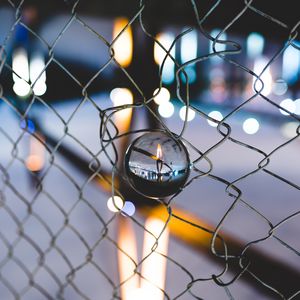 Preview wallpaper ball, glass, fence, mesh, light