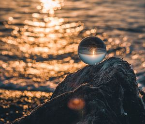 Preview wallpaper ball, glass, glare, sea, sunset