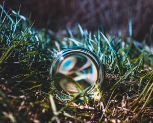 Preview wallpaper ball, glass, grass, close-up