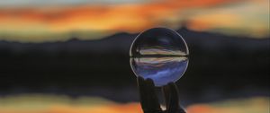 Preview wallpaper ball, glass, hand, blur