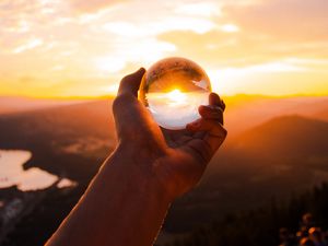Preview wallpaper ball, glass, hand, sunset